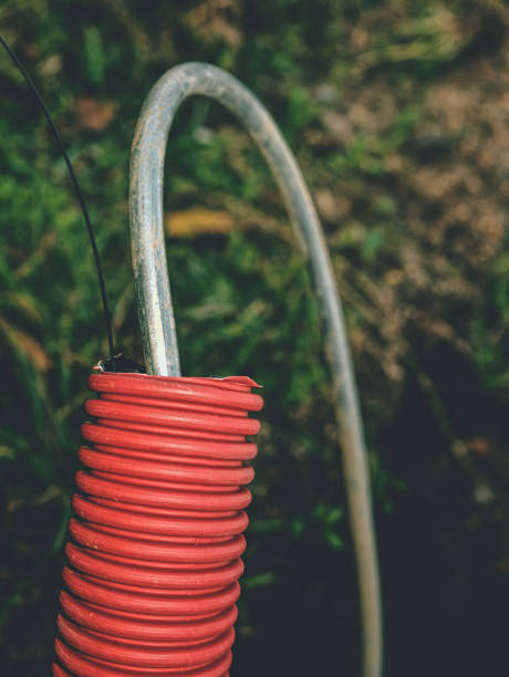 istock Steel wire in protective lplastipipe under ground.  Construction Area 1168782876