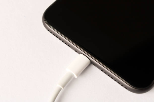 istock Smartphone on charge . On white background. Close up. 1168783984