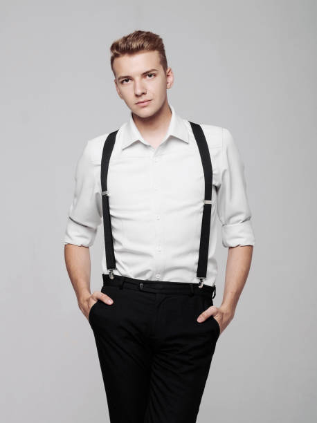istock young serious man on gray background in classic style 1168785225