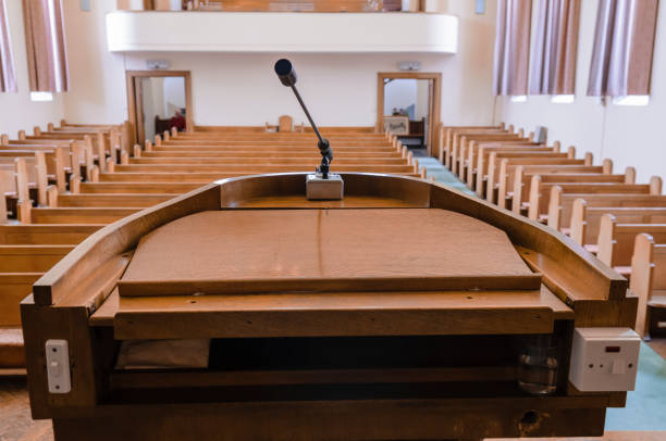 istock Wooden pulpit and pews in a plain church. 1168785407