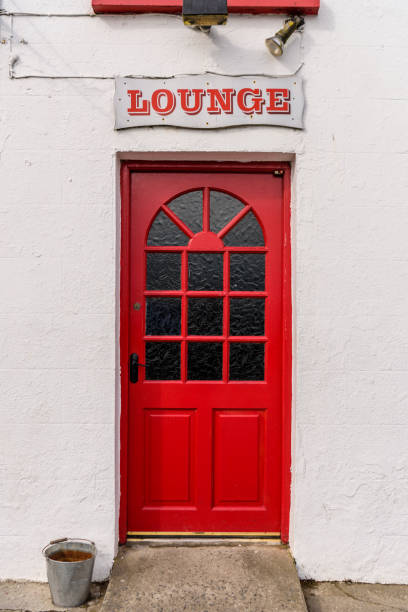 istock Red door into an Irish pub 1168785433