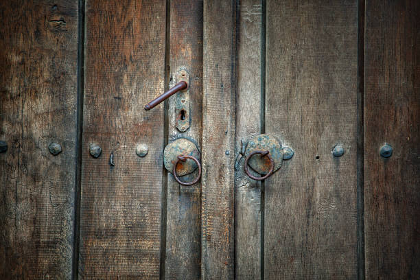 istock Old door with the metal round doorknobs 1168793320