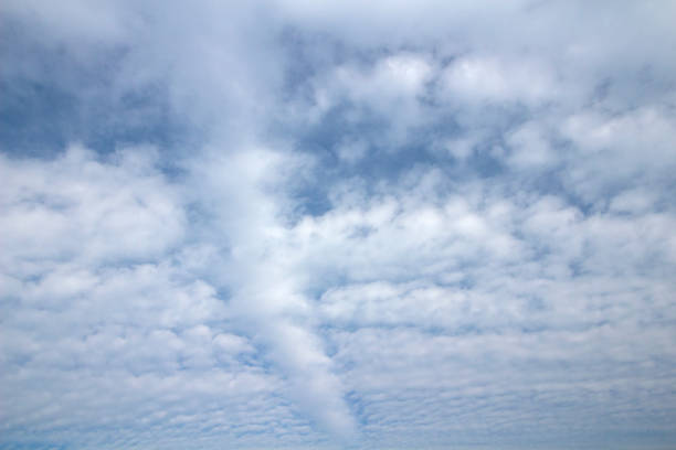 istock Lines of white clouds against a blue sky 1168794871