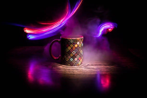 istock Beautiful eastern style textured ceramic cup of coffee (or tea) with smoke over dark toned background. 1168796666