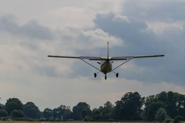 Photo of a landing  plane on a gray background