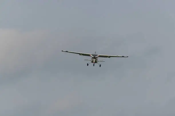 Photo of a landing  plane on a gray background