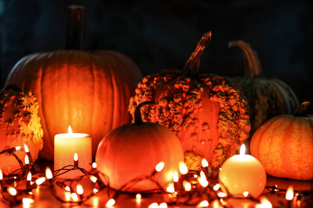 istock Halloween, autumn scene with pumpkins and candles. 1168797004