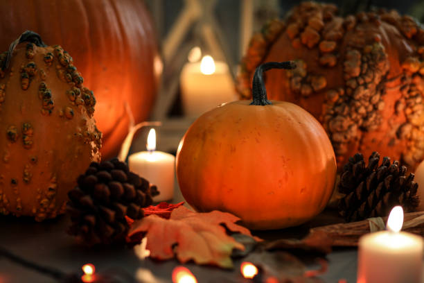 istock Halloween, autumn scene with pumpkins and candles. 1168797028
