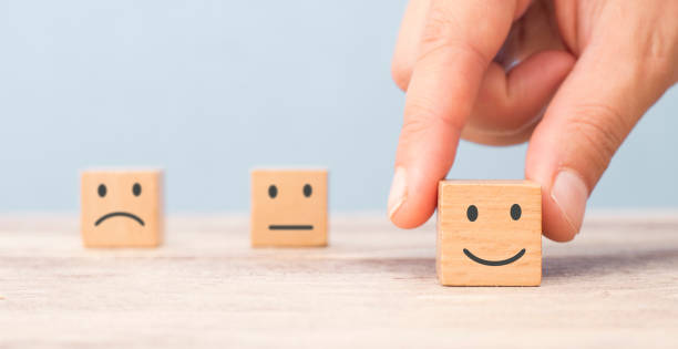 istock Customer satisfaction concept. Hand lifts smiling face 1168799024