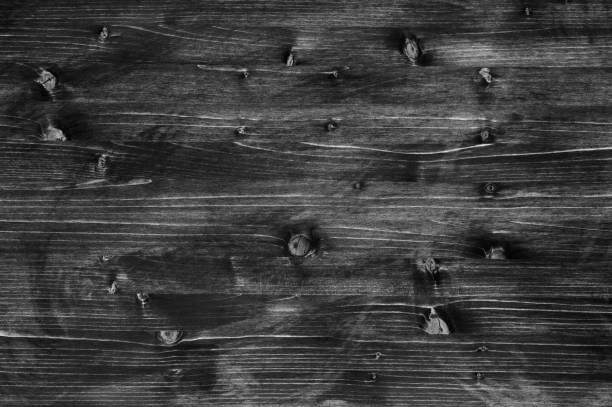 istock Shabby wooden rustic textured black background with light streaks 1168799069