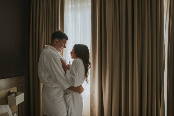 istock Young loving couple in their bedroom 1168799159