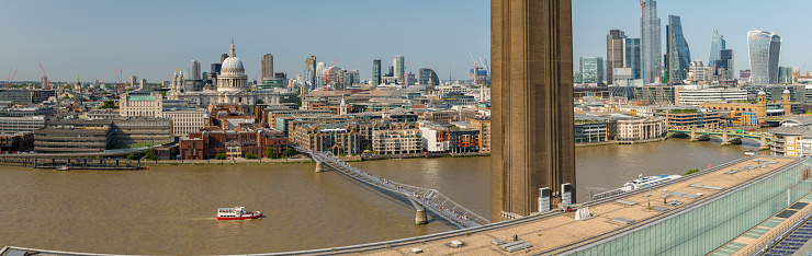 View across the Thames to Saint Paul's Cathedral and the skyscrapers of the financial district.