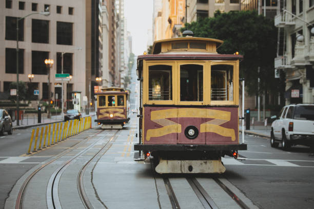 San Francisco Cable Cars on California Street, California, USA Beautiful view of traditional historic San Francisco Cable Cars on famous California Street in the early morning with retro vintage pastel toned filter effect, central San Francisco, California, USA san francisco county city california urban scene stock pictures, royalty-free photos & images