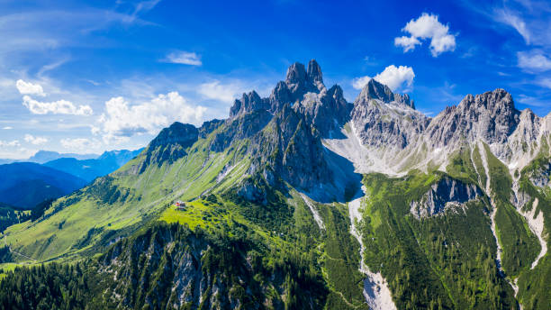 aerial view in the dachstein mountains with a view of the large bischofsmütze - dachsteingebirge stock-fotos und bilder