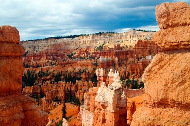 istock View on valley with red, orange ,white color sedimentary sharp tower like  rocks (hoodoos) 1168804532