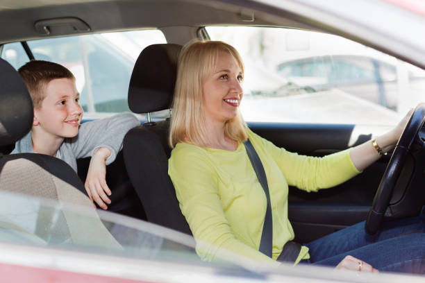 istock Mother and son using car during sightseeing tour 1168809043