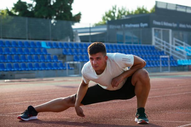 istock Athlete Man Preparing And Runs Hurdles for Track and Field 1168809095