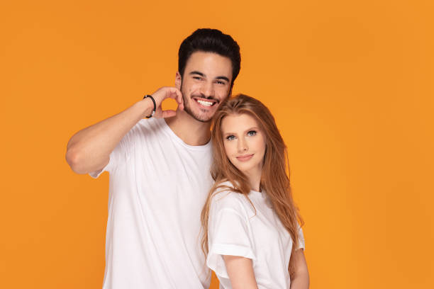istock Happy youg couple posing together in studio. 1168809277