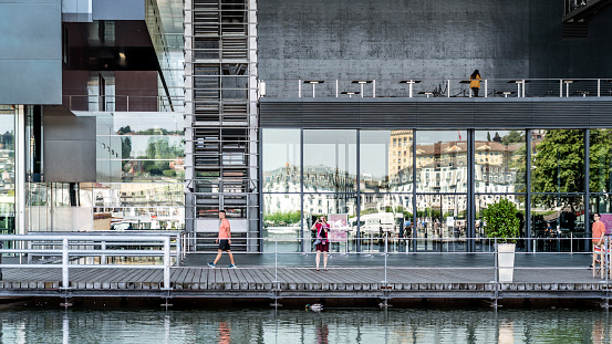 Lucerne, Switzerland - June 18, 2019: Lucerne culture and congress hall (KKL). This is a modern center for congresses and concerts in Lucerne. Switzerland. Some tourists are standing in front of the building.