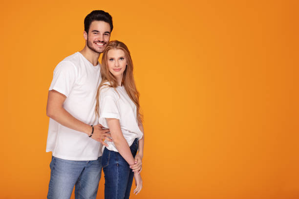 istock Happy young couple posing in studio. 1168809350