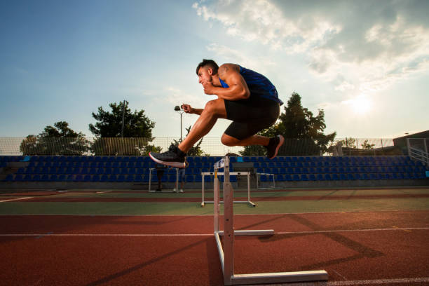 istock Athlete Man Preparing And Runs Hurdles for Track and Field 1168809428