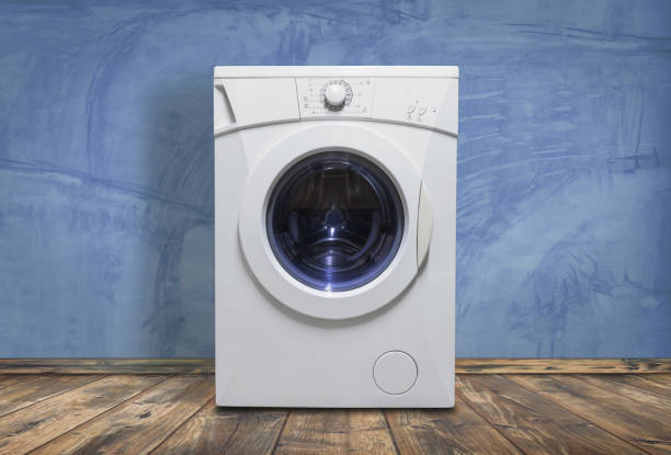 istock Modern washing machine in laundry room interior 1168811006