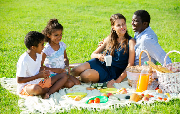 istock Couple with children at picnic 1168811105