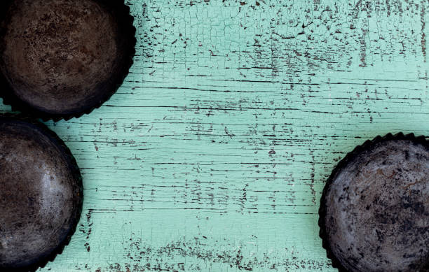 istock Old vintage baking pan and tins on wooden background. 1168811279