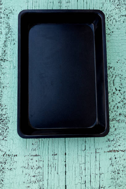 istock Old vintage baking pan and tins on wooden background. 1168811284