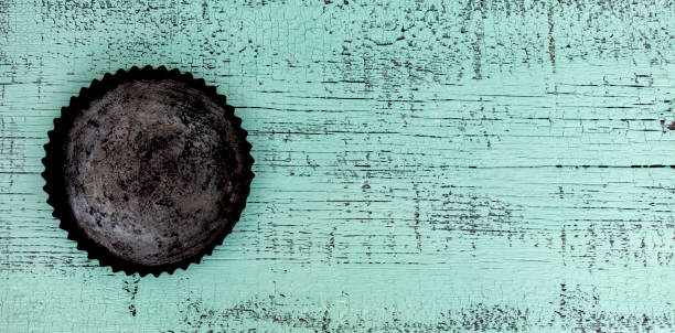 istock Old vintage baking pan and tins on wooden background. 1168811288
