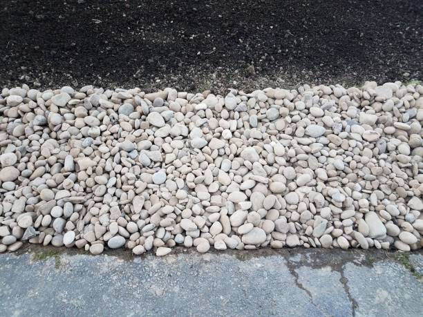 istock white and grey stones or rocks with brown dirt and asphalt 1168818785