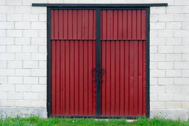 istock Rust Colored Metal Door On Stone Wall 1168819629