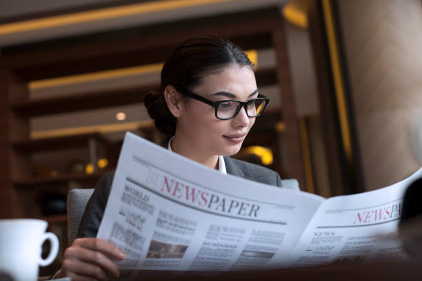 istock businesswoman reading a newspaper 1168820605