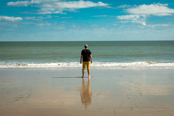 istock Man on the beach, Edisto Island South Carolina USA 1168820607