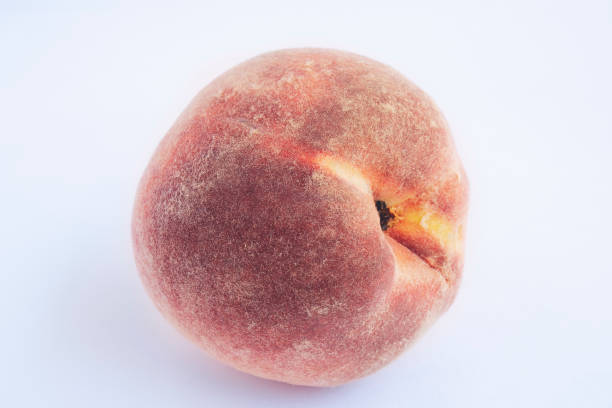 istock Red peach with leaf isolated on white background. Full depth of field (all details in focus). Clipping path included. 1168823455
