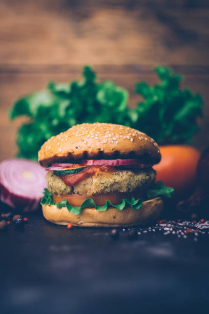 istock Vegetarian burger (home made burger) with chickpea cutlet and vegetables. Veg concept. Copy space. 1168824475