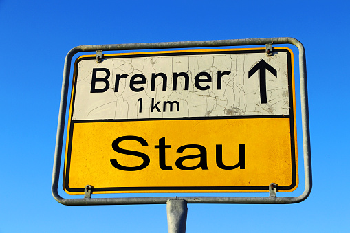 Sign with traffic jam at Brenner Austria Italy