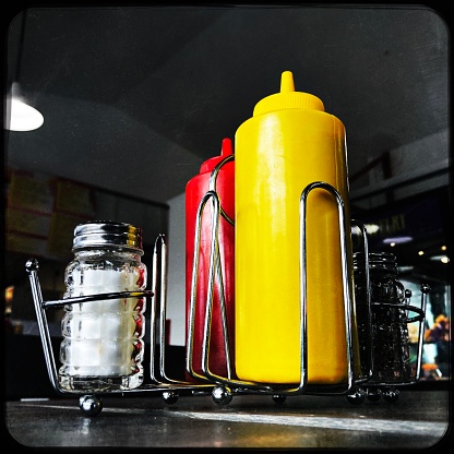 Ketchup and Mustard Squeeze bottles with Salt and Pepper in a Caddy