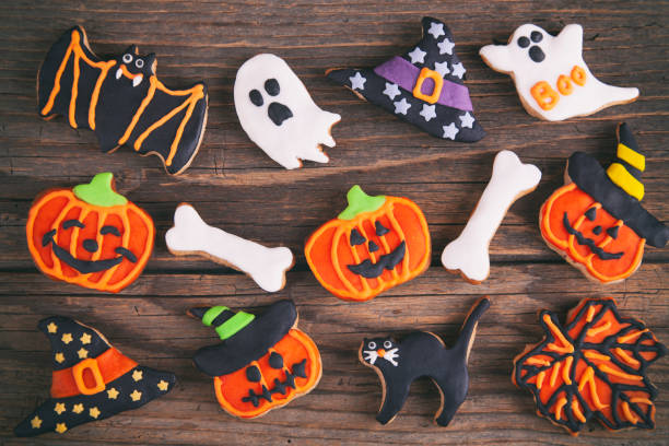 istock Halloween homemade gingerbread cookies on rustic wooden table 1168830468