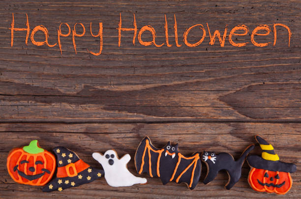 istock Halloween Homemade Gingerbread Cookies on rustic wooden table 1168830484