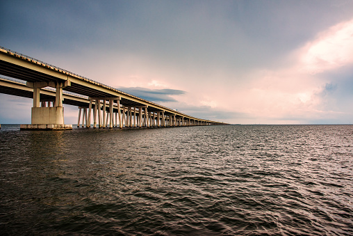 One of the main east-west thoroughfares crossing the United States, Interstate 10, as it spans Lake Pontchartrain just outside of New Orleans, Louisiana.