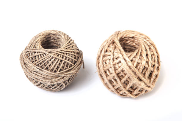 Isolated ball of natural twine.