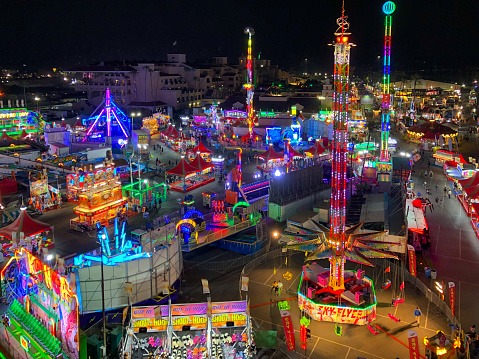 Aerial view of San Diego County Fair, California, USA. Colorful amusement park with attraction at night.