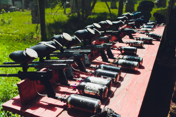 istock Paintball guns on a wooden table. play paintball. 1168840034