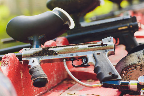 istock Paintball guns on a wooden table. play paintball. 1168840111