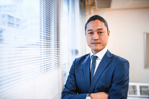 istock Confident Japanese Hospital Administrator Looking at Camera 1168842170