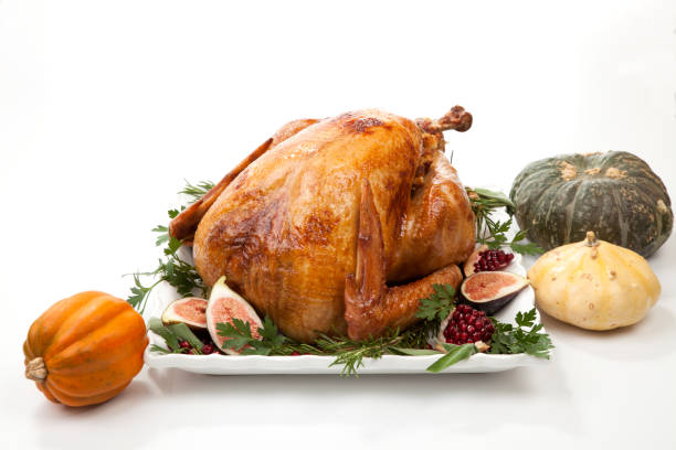 istock Traditional Roasted Turkey on White With Pumpkin 1168843367