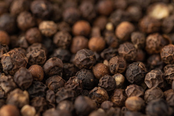 istock Peppercorn Pea Background. black pepper peas, closeup. macro, horizontal frame 1168844104