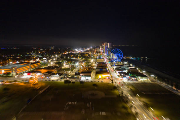 istock Motion blur flying approach Myrtle Beach at night city lights 1168844843