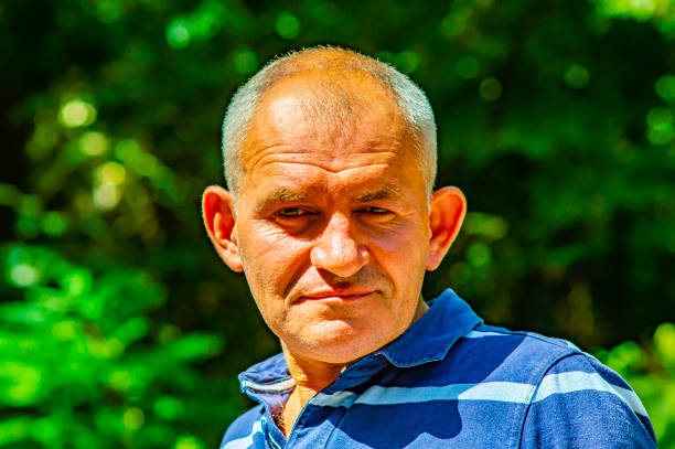 istock Portrait of a gray-haired middle-aged man. 1168848963